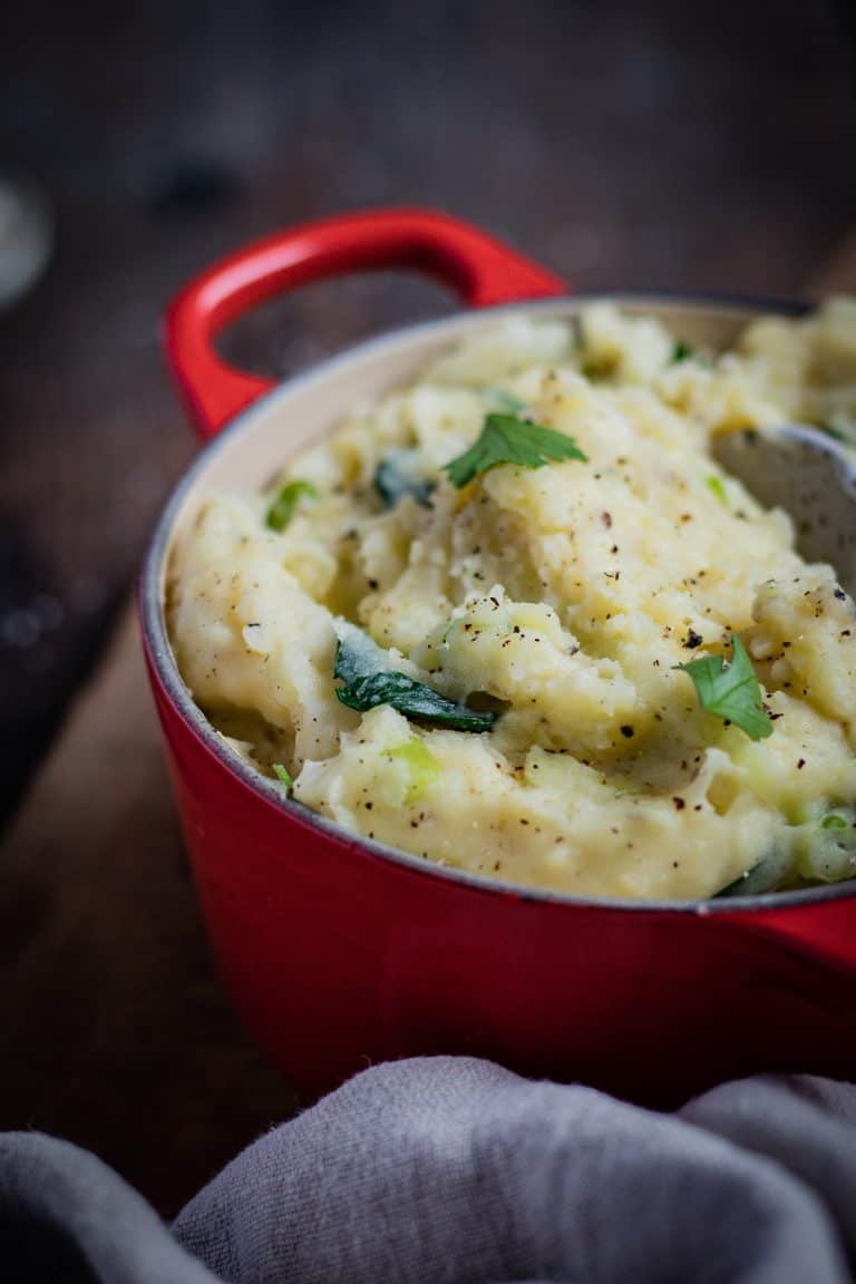 creamy colcannon mash in a red Le Creuset pot