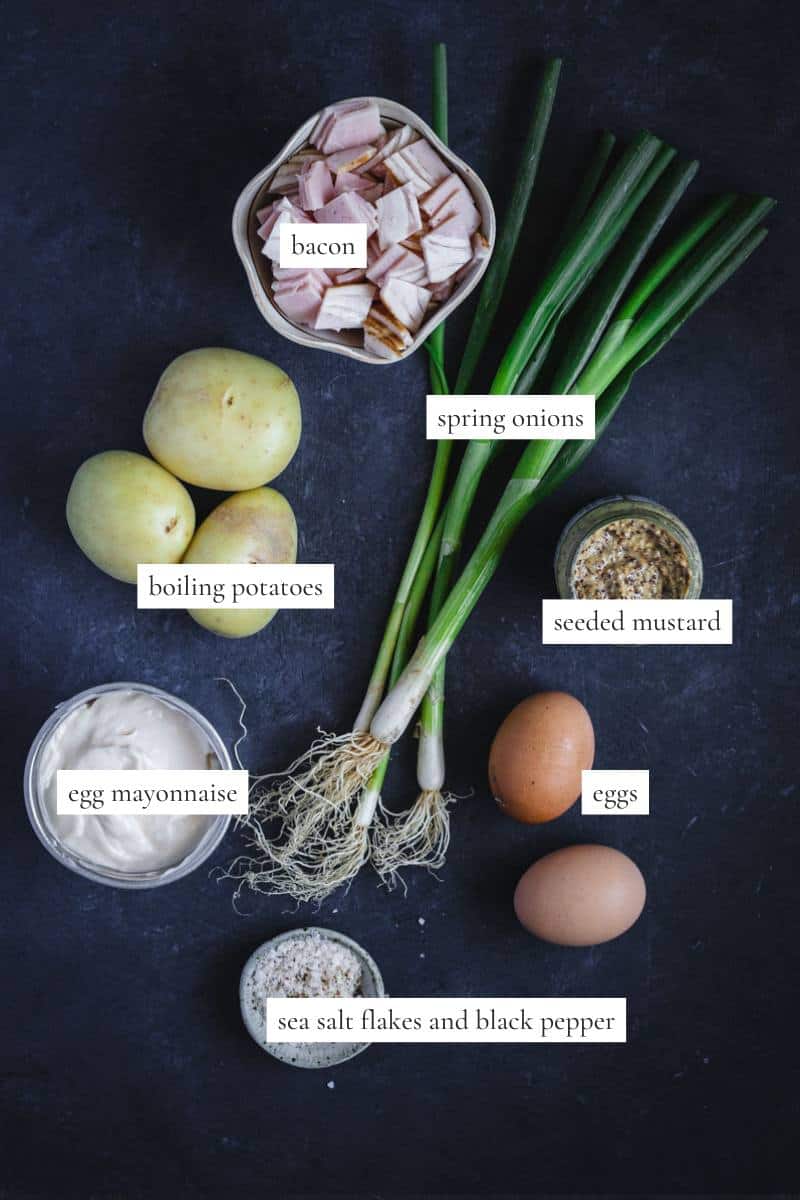 All the ingredients you need to make a creamy bacon and egg potato salad.