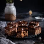 a round cooling tray full of Mars Bar slice squares
