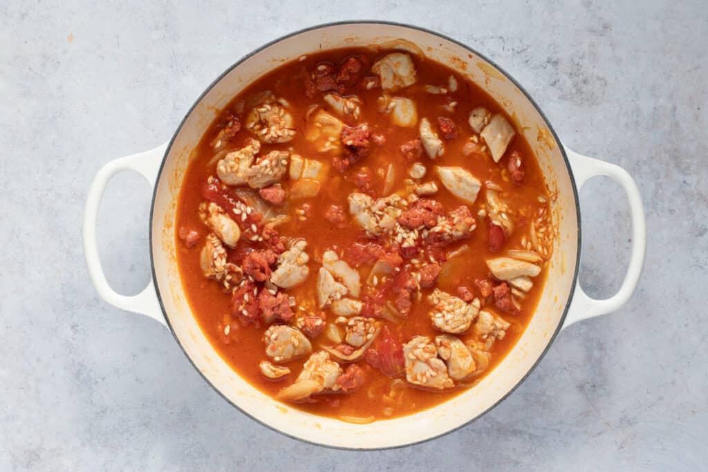 Stock is added to the pan.