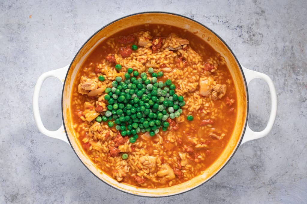 Frozen peas are added to the risotto.