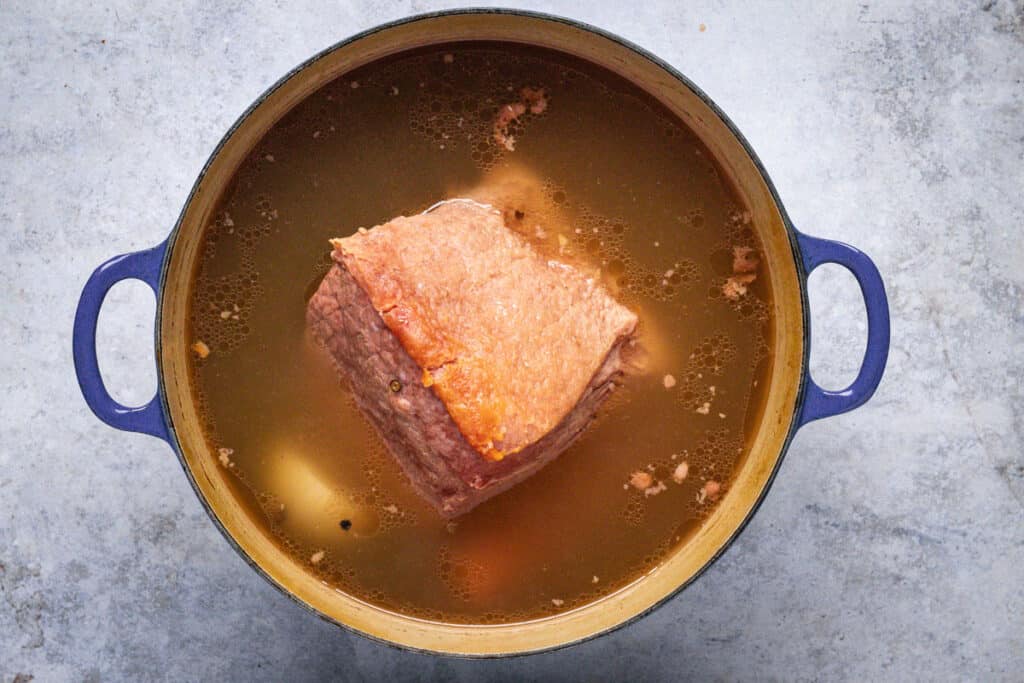 A pot of slow-cooked beef silverside, just out of the oven.