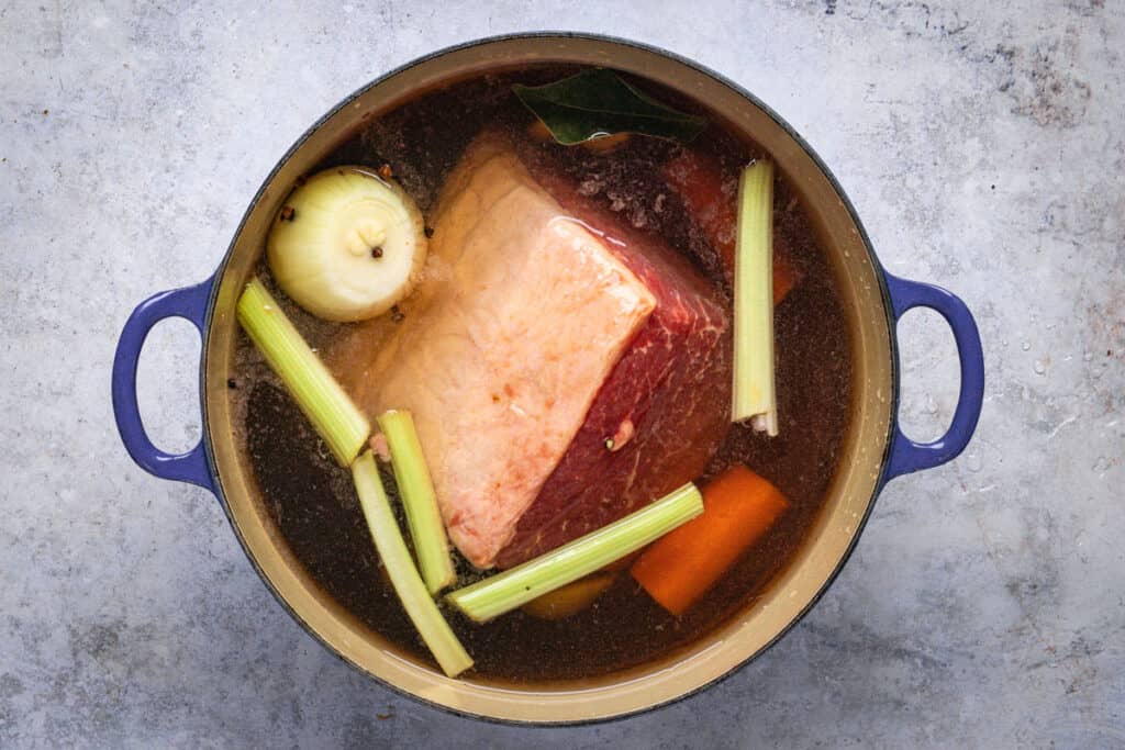 A Pot of corned beef with all the ingredients in it ready to go in to the oven.