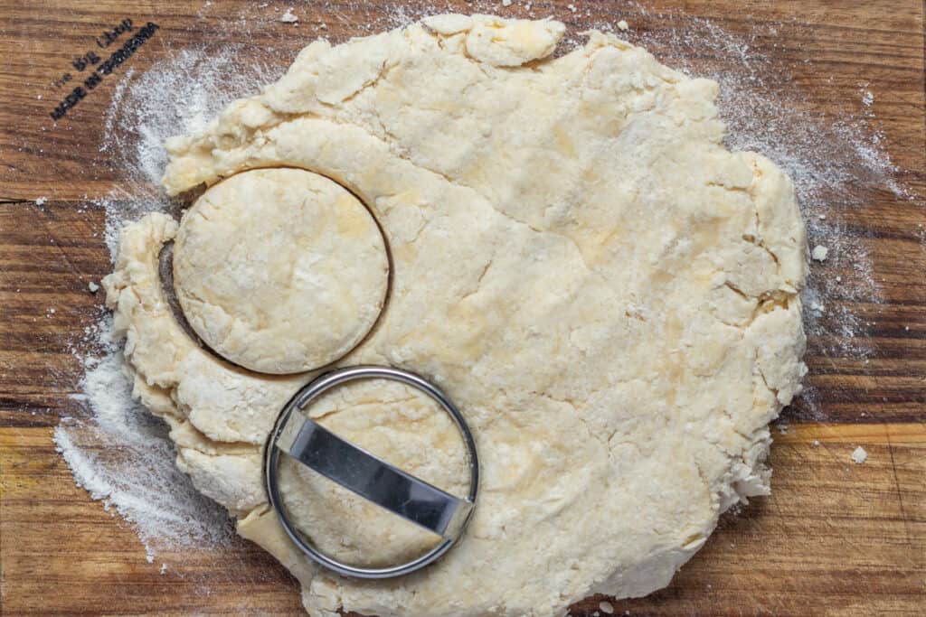 The dough is rolled out and scones are cut out.