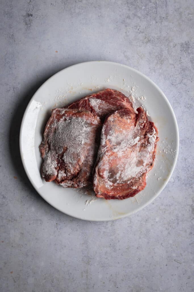 Beef Cheeks dusted in flour.