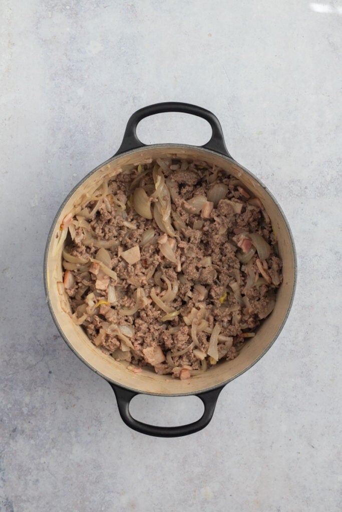 Add beef mince to the pot and brown.