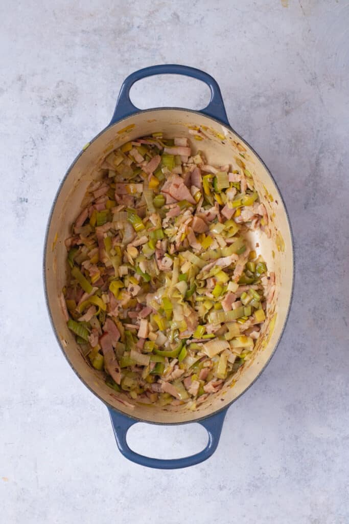 Saute the bacon and leek on a low heat.