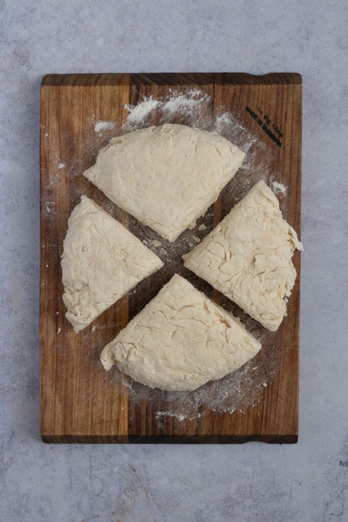 The dough is cut into four quadrants.