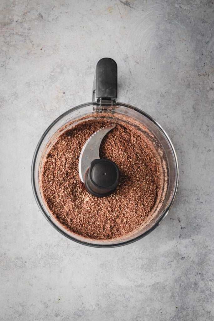 Ground up ingredients in the food processor bowl.