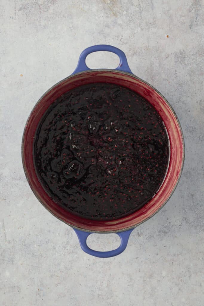 Jam cooked and ready to bottle in a cast iron pot.