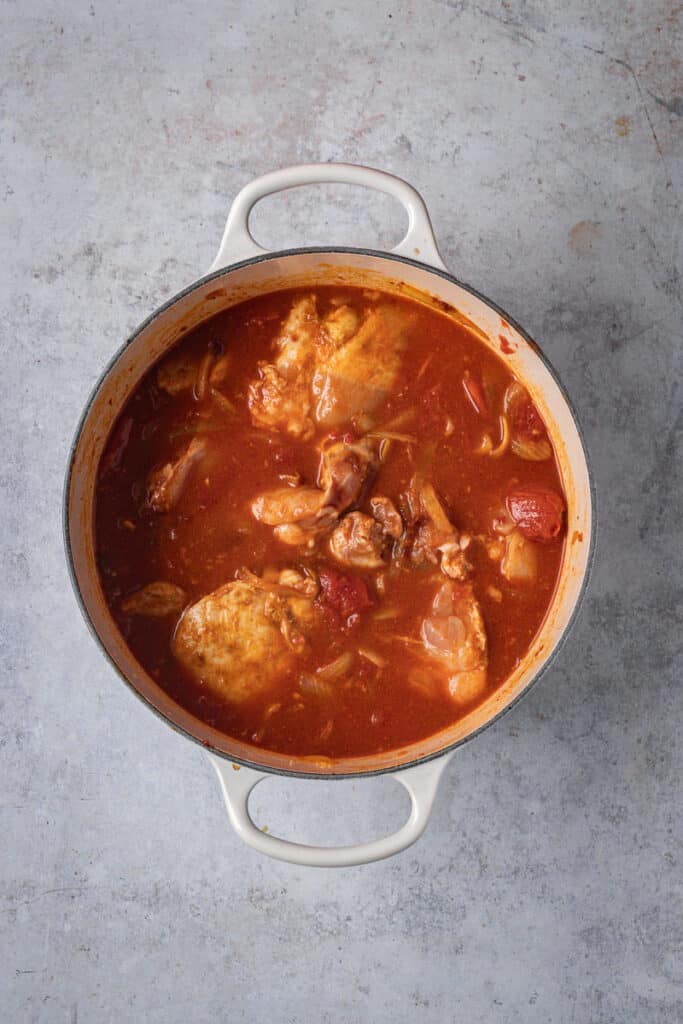 All remaining ingredients (except beans) are then added to the pot and mixed through. 