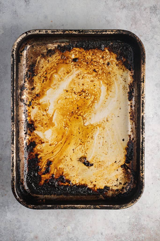 The pan without drippings but with the frond (stuck on bits) still there.