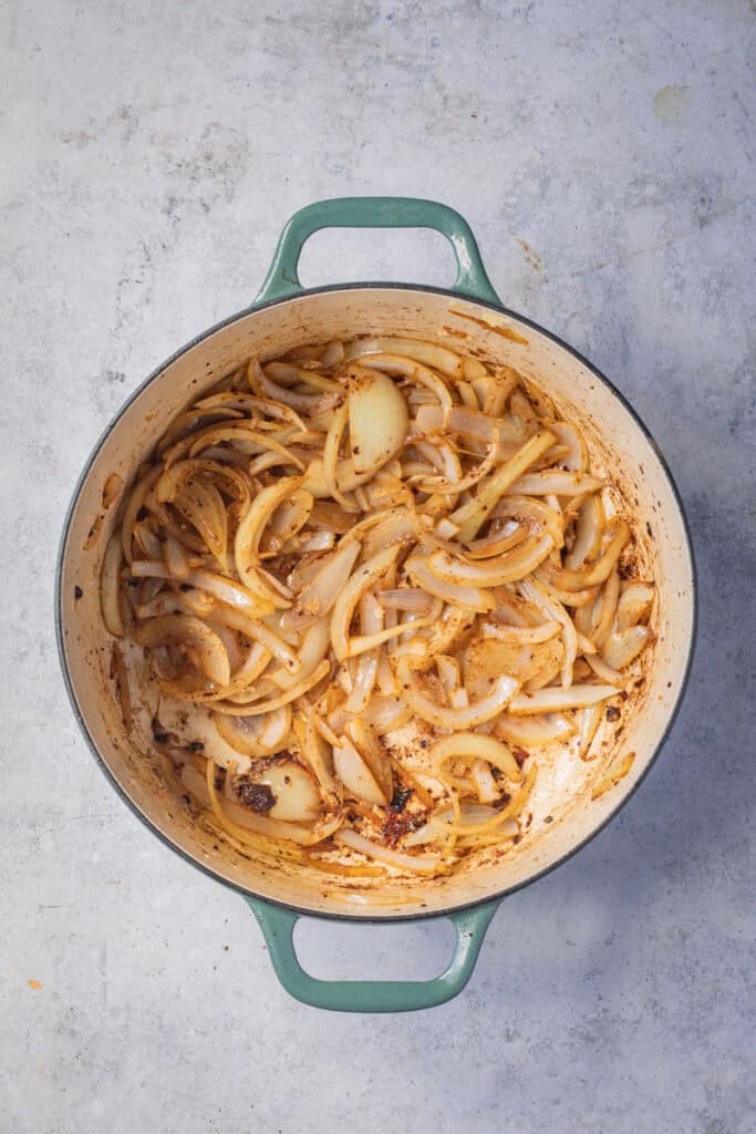 Onion and garlic sauteing in the Dutch oven.