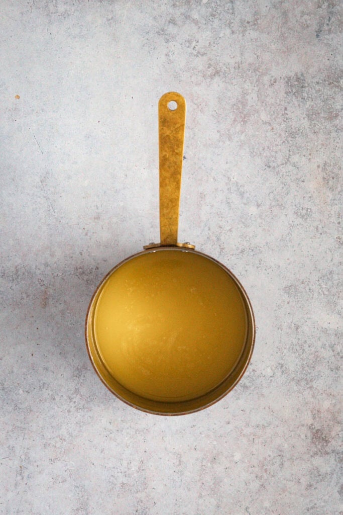 The butter is now melted and whisky has been added to it.