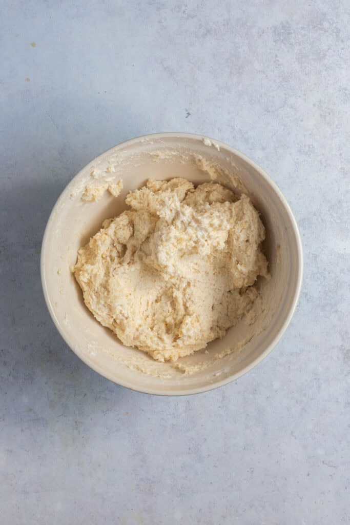 Grek yogurt has been added to the to make a wet cobbler dough.