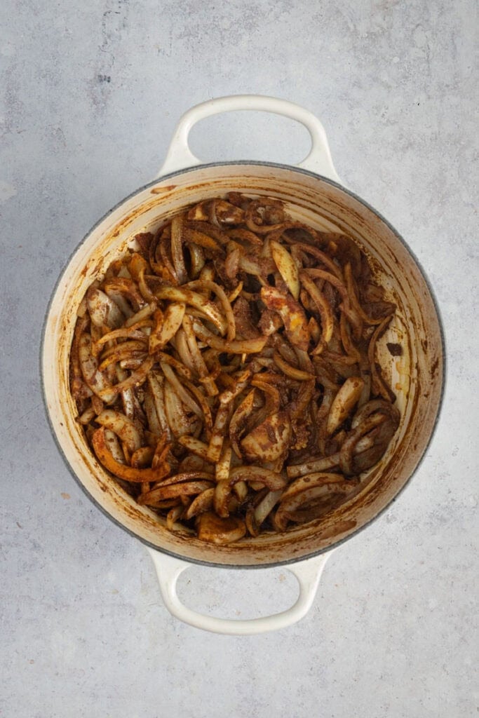 Onions being sauteed with spices.