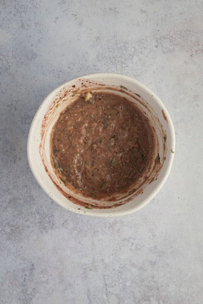 A small bowl with a red wine marinade.