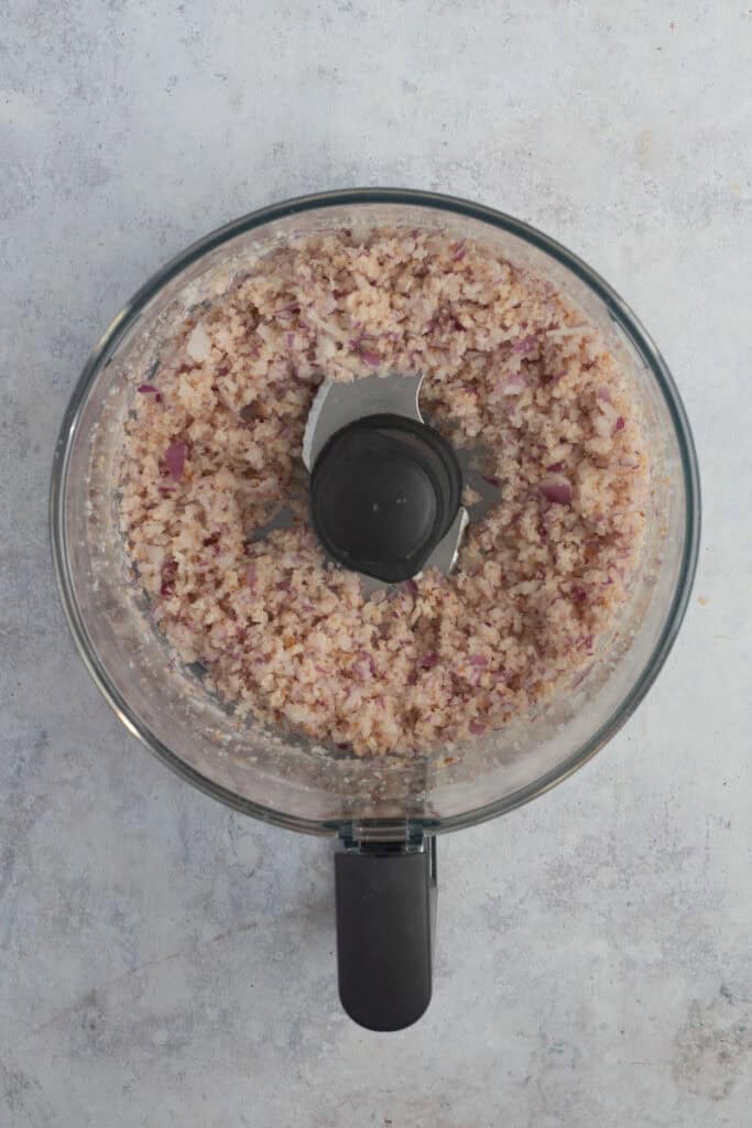 Red onion has been added and diced along with the breadcrumbs.