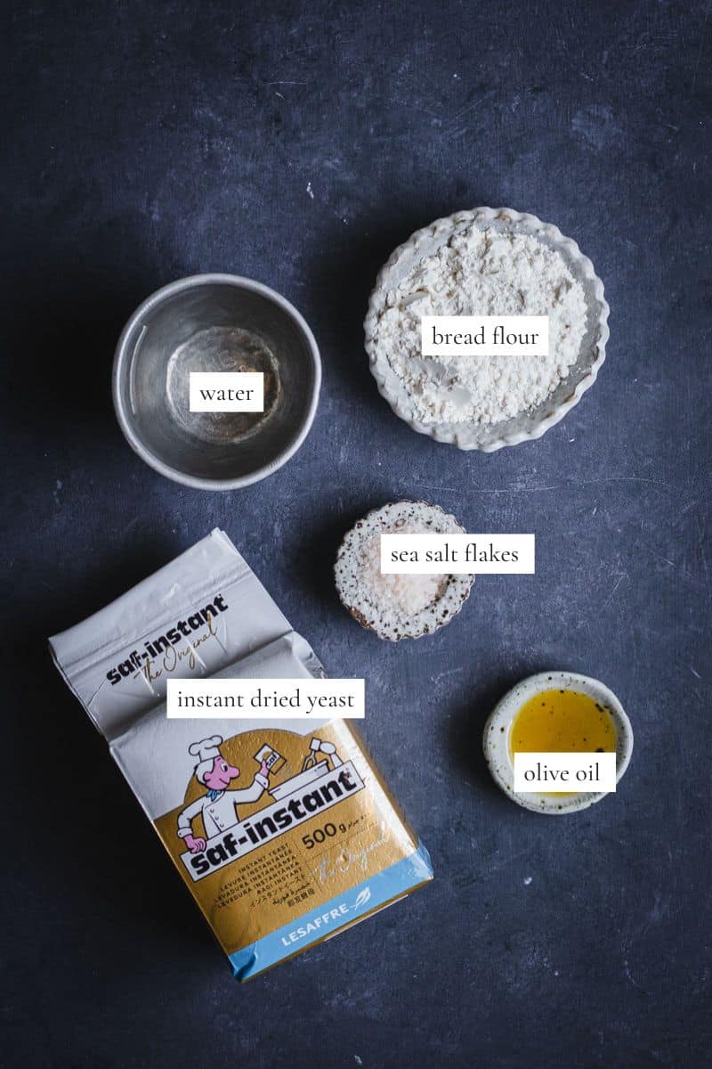 All the ingredients you need to make a loaf of Dutch oven bread.