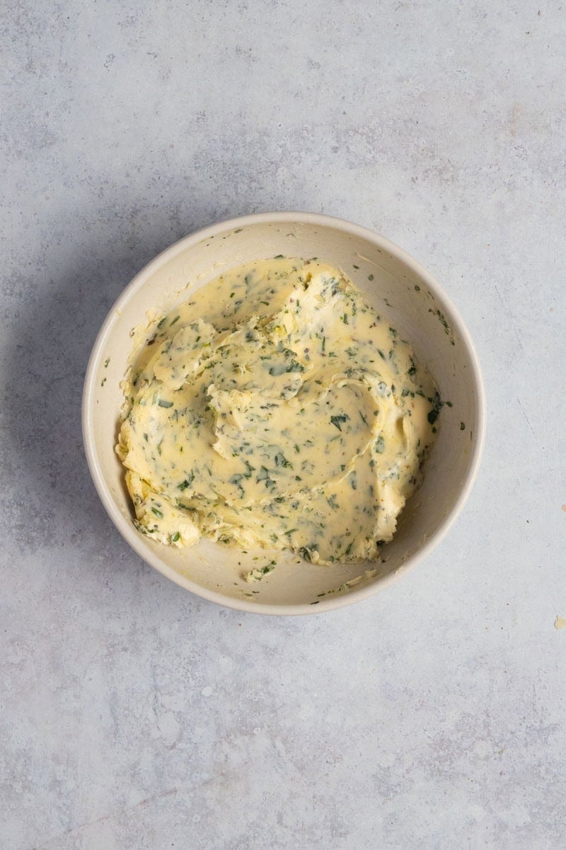 Lemon herb butter in a bowl.