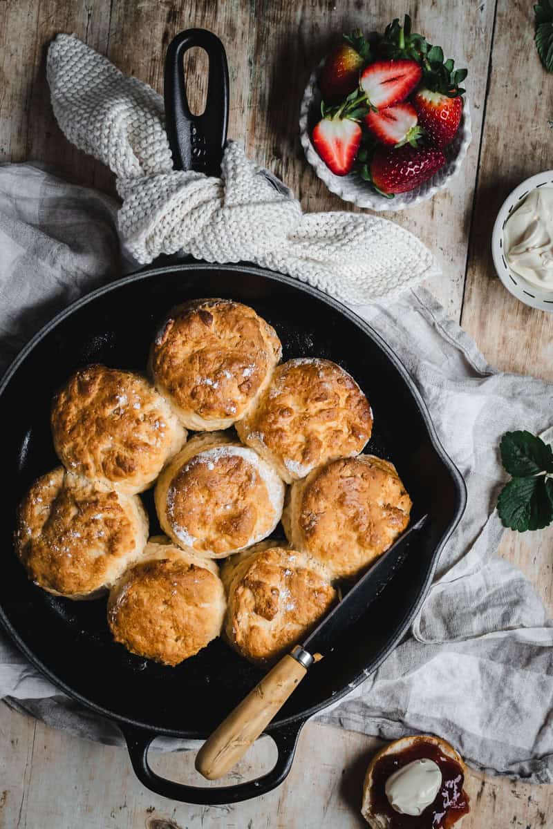A skillet full of golden, just out of the oven lemonade scones.