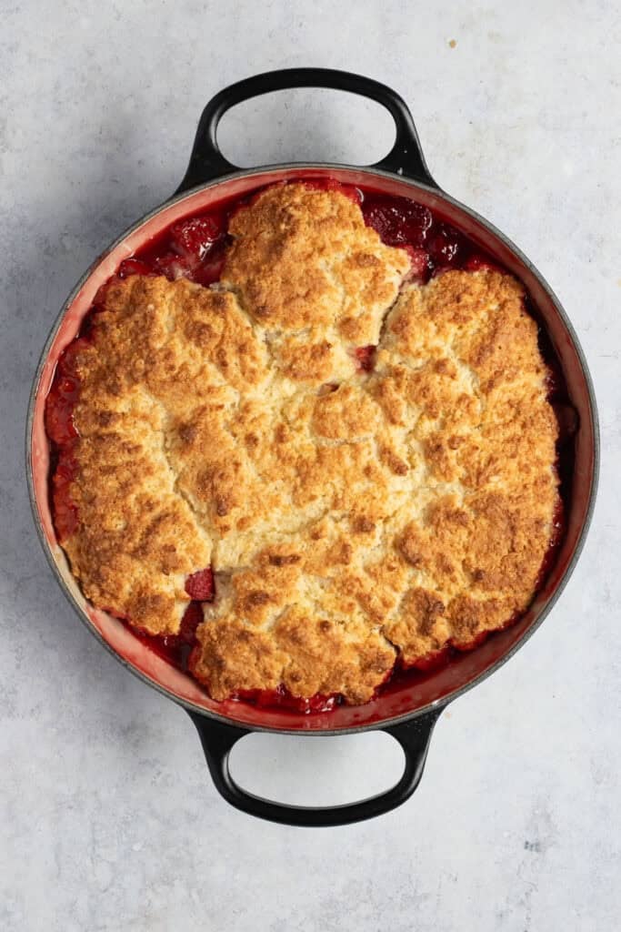 A finished, baked strawberry cobbler.