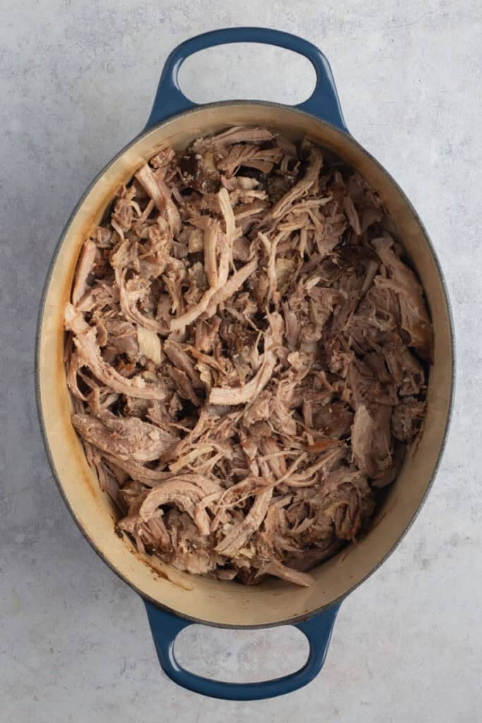 A Dutch oven of shredded pork.
