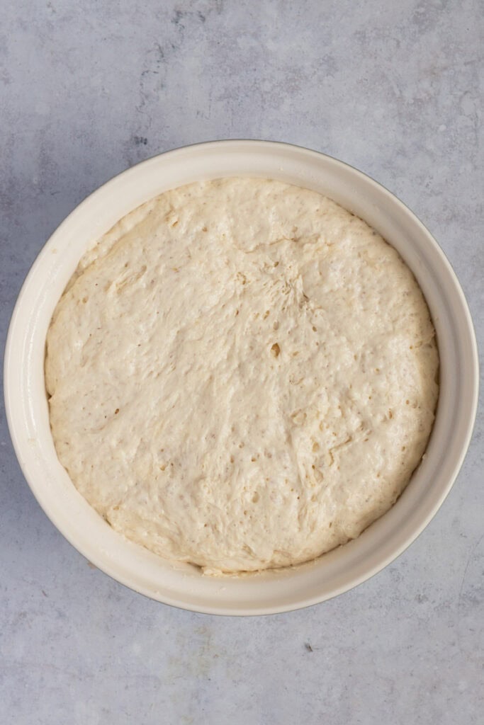 After the first rise, a proved bread in a bowl. 