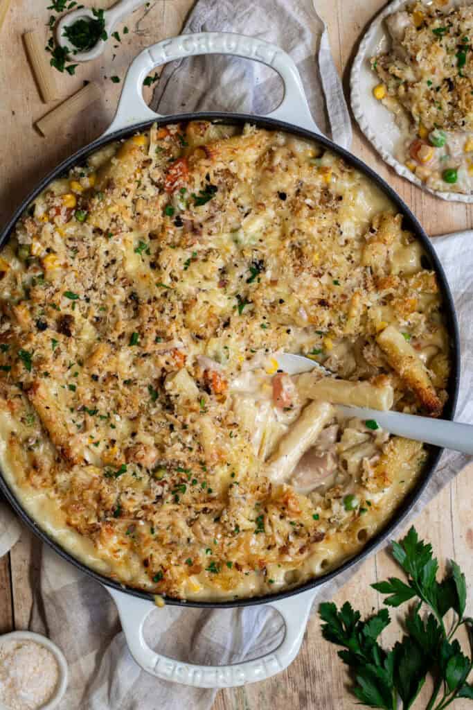 A shallow cast iron casserole with tuna mornay.