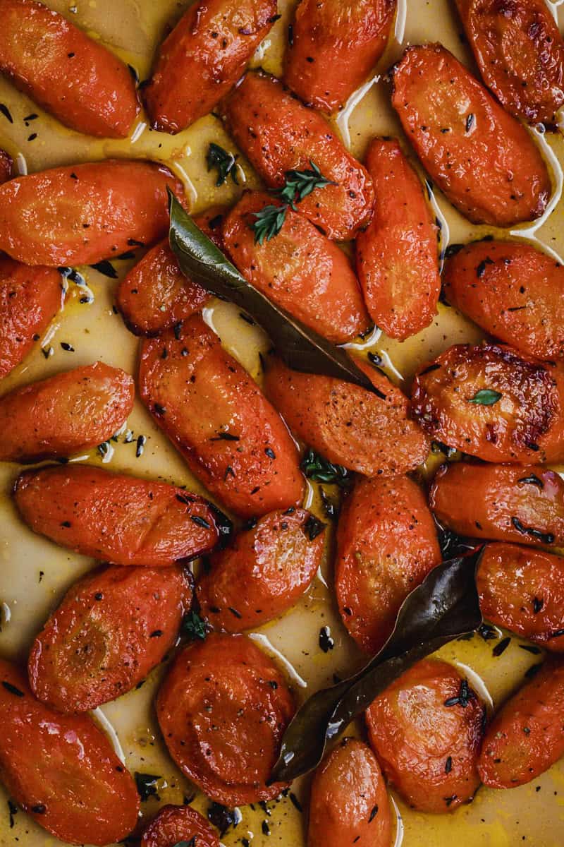Close up of a tray of honey roasted carrots.