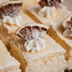Close up of a tray of lemon curd cheesecake squares.
